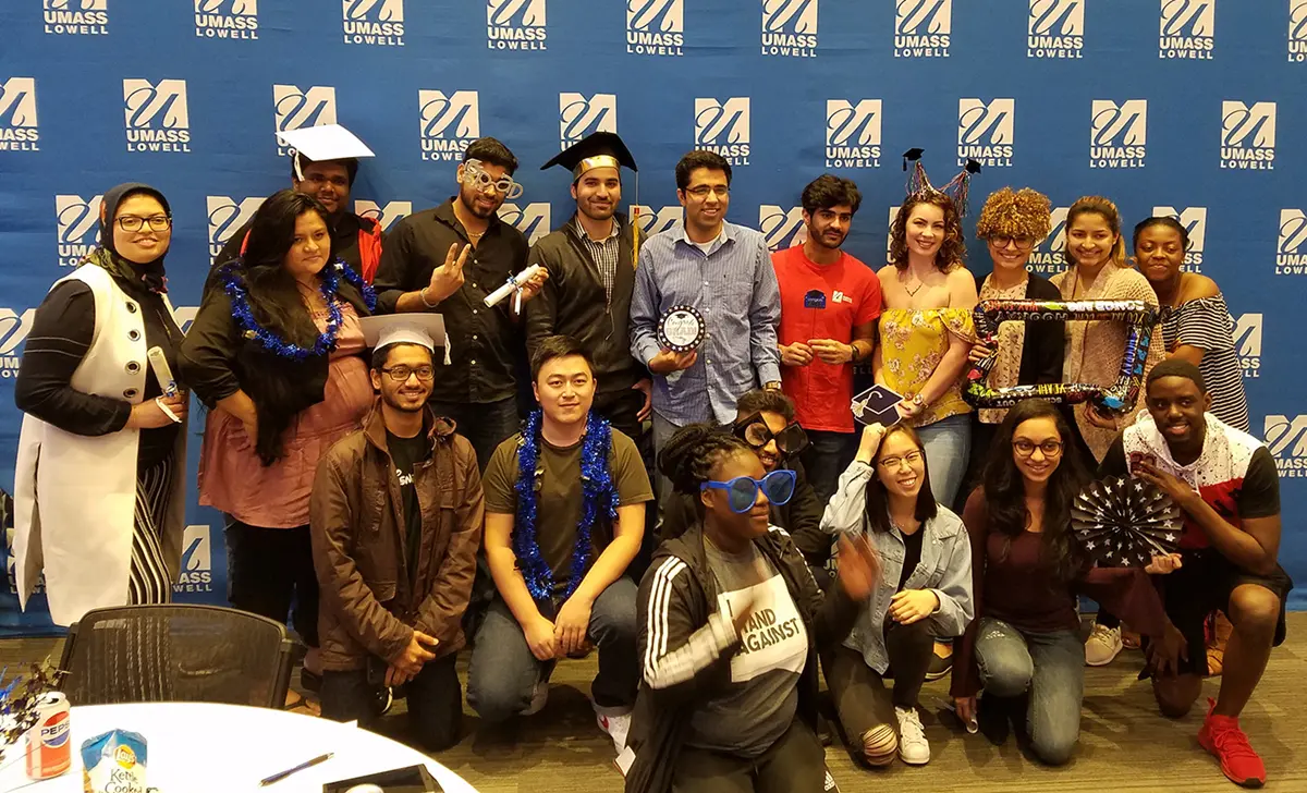 Group of seniors posing for a picture, celebrating their graduation