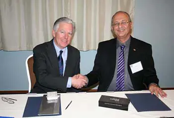 UMass Lowell Chancellor Marty Meehan, left, shakes hands with Ben-Gurion University Rector Zvi HaCohen at the signing of the memorandum of understanding that officially marks the start of a new partnership between the institutions.