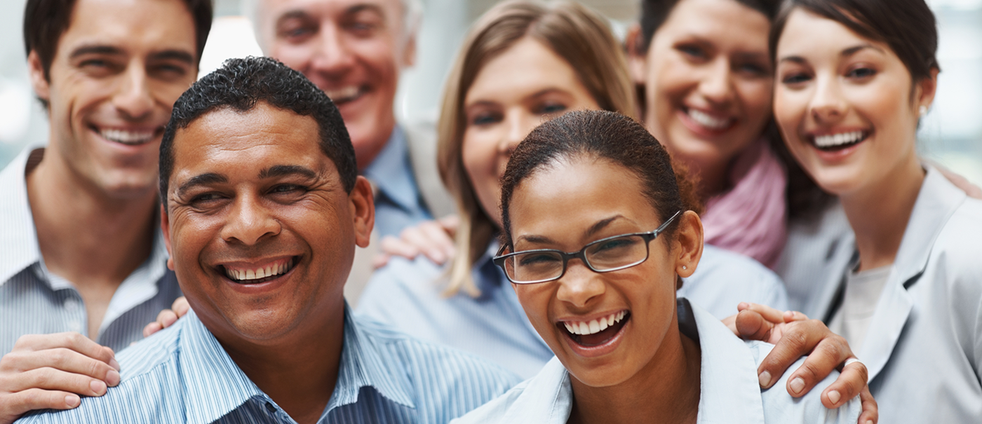 A stock image of a diverse group of people smiling at the camera.