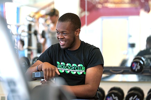 Ralph Saint Louis smiles while working out at the CRC