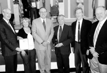Those honored by EPA include, from left, Project Director Paul Morse; Marketing and Outreach Coordinator Therese O'Donnell; New England Regional Administrator Curt Spalding; UMass Lowell Professor Dr. Kenneth Geiser; principal Investigator of consortium, UMass Lowell professor Craig Slatin; and Training Manager David Coffey.