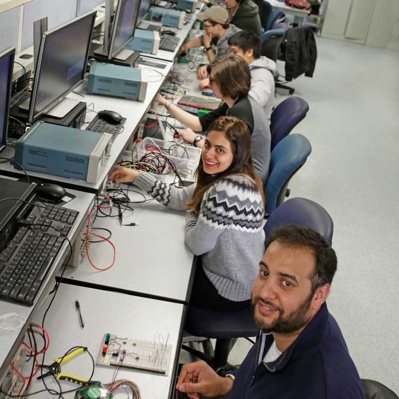 Electrical and computer engineering students wire computers at a UMass Lowell lab