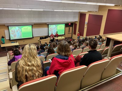 Girl Scouts sitting in seats at Weed Lecture Hall