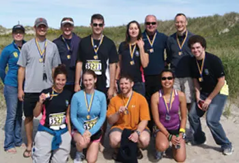 Robert Malloy (back row, third from right) organizes a team of students, faculty and alumni of UML's plastics engineering department to compete in New Hampshire's annual "Reach the Beach" 200-mile overnight relay race.