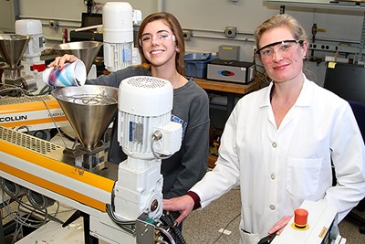 Meg with student in the lab