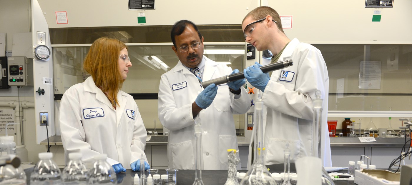 Professor Pradeep Kurup works with Graduate Students in his lab.