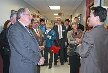 Speaker of the House Robert DeLeo, left, asks Prof. Seongkyu Yoon, right, a question about the Massachusetts BioManufacturing Center on a recent visit to campus. Looking on are, from left, Rep. Stephen DiNatale, Rep. Corey Atkins, Rep. Thomas Sannicandro and Rep. Denise Provost.