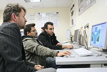 From left, Prof. Martin Margala,&nbsp;Vikas Kaushal and Ignacio de la Torre from the Universidad de Salamanca in Spain&nbsp;working in the lab on the design of a &ldquo;ballistic deflection transistor.&rdquo;