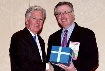 Chancellor Marty Meehan receives the CASE District I Chief Executive Leadership Award from Timothy Lawlor, CASE District I Board chairman and assistant vice president for development at Stonehill College, at the CASE District I/II conference in New York Jan. 23.