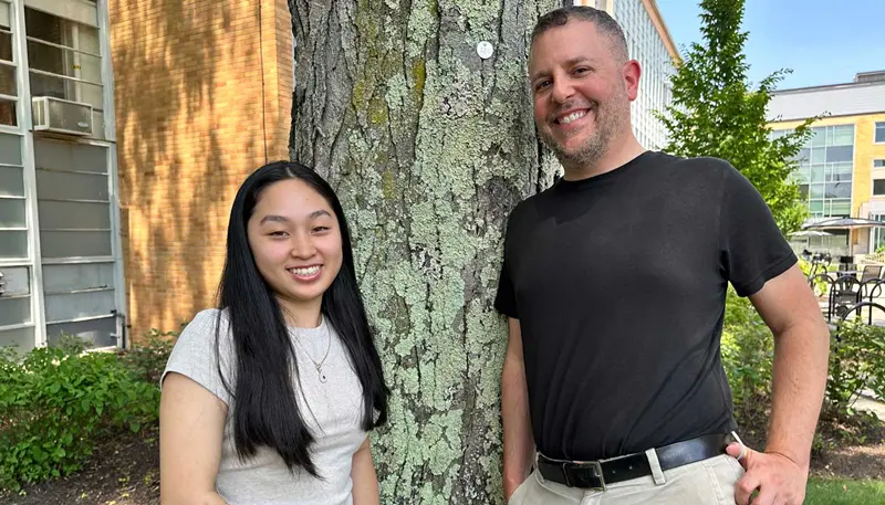 UMass Lowell student Melanie Khiem poses with Visiting Lecturer Matthew Beyranevand.