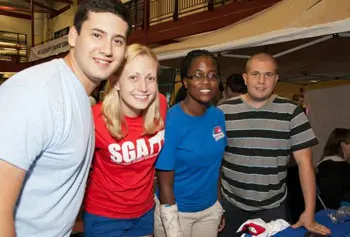 Student Government President Brian Dano, left, and members Tonya Lee Allen, Tamara Vincent and Ben Levesque greeted new students to campus at the recent club fair. Photo by Meghan Moore.