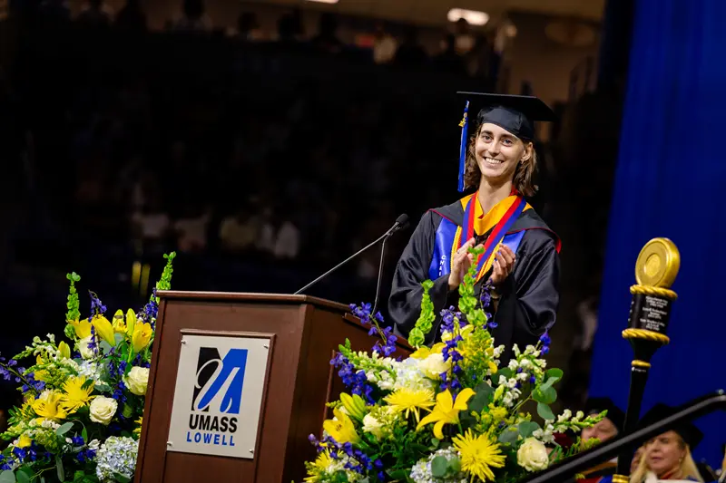 Sydney Selby delivers a speech at the UMass Lowell commencement ceremony.