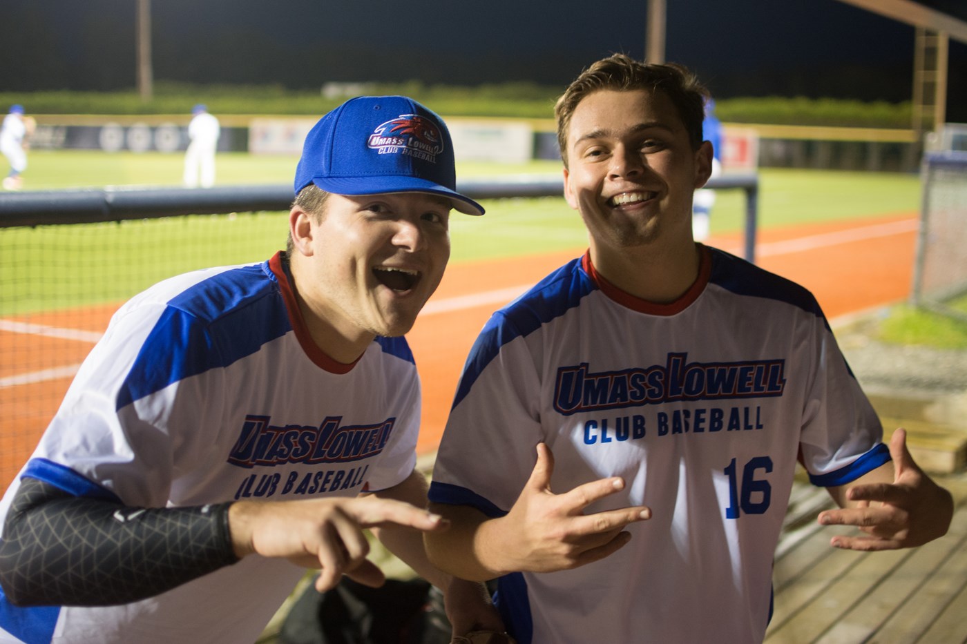 2 students posing from the Men's Club Baseball team.