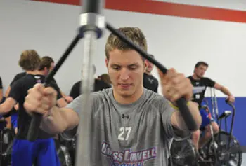 Sophomore defenseman Zack Kamrass trains with his teammates in the new hockey performance center. Photo by Bob Ellis.