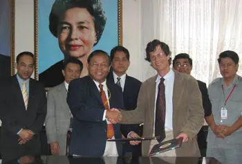 Dr. Chea San Chanthan, PUC president, and Chigas at the formal signing ceremony for the MOU.