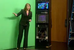 UMass Lowell 2011 graduate Heather Jaffe works in front of the "green screen" while interning for NECN's meteorology department.