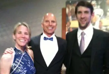 UMass Lowell Legal Studies Prof. Michael E. Jones and his wife, Christine, visited with Olympic swimmer Michael Phelps for an event in Baltimore in May.