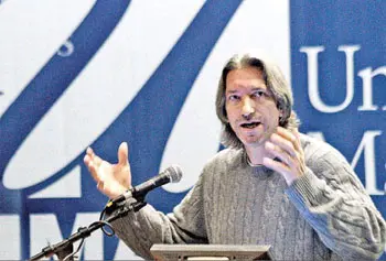 Human-rights activist John Prendergast speaks at UML s Day without Violence yesterday.