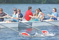 Instructor Dave Cormier of UMass Lowell conducts crew classes from his seat in the boat in a local program centered at the UML Bellegarde Boathouse. Lowell Sun photo by Bob Whtaker
