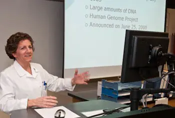 Beth Halaby, an instructor in the Clinical Laboratory and Nutritional Sciences Department, uses the integrated teaching podium in Weed Hall for discussing and projecting information.