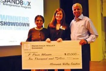 Trisha Blanchet, center, of Chelmsford, is awarded a $10,000 first-place prize for her Operation Canine proposal from the Merrimack Valley Sandbox at UMass Lowell Thursday night. Awarding the grant are Jaishree Deshpande, left, and Desh Deshpande, co-founders of the Deshpande Foundation.
