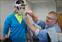 Sean Collins attaches a mass flow sensor that measures oxygen intake.