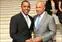 Vladimir Saldana accepts the '29 Who Shine' award from Gov. Deval Patrick at the Massachusetts State House on May 2. Photo by KulbakoPhoto