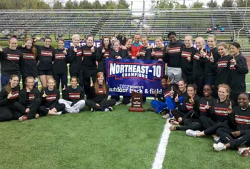 Members of the UMass Lowell women's track and field team pose with their hardware after the River Hawks captured another Northeast-10 Championship.