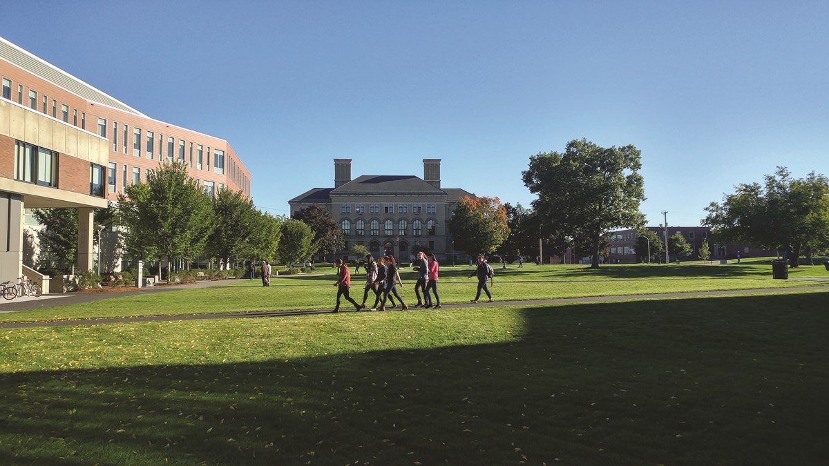 Students walk across South Campus quad at UMass Lowell