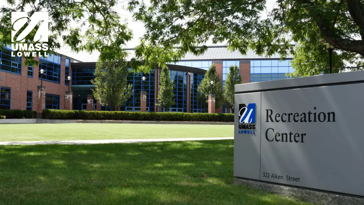 Zoom background displaying an exterior view of Campus Rec and sign with UMass Lowell logo in corner.