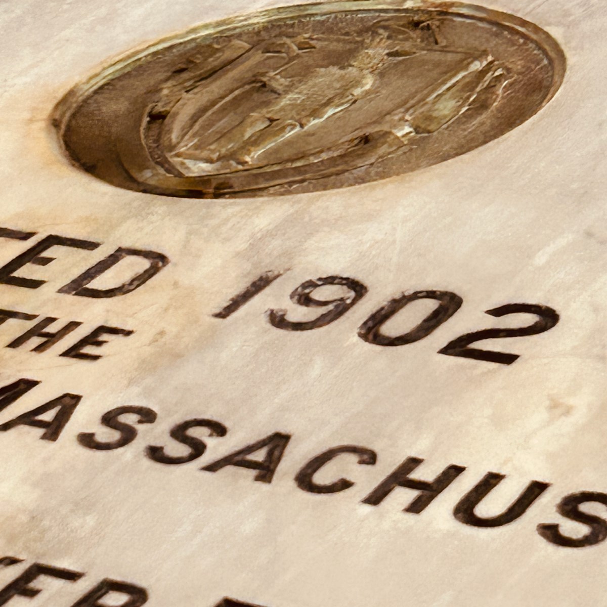 Zoomed-in view of plaque at Southwick Hall entrance