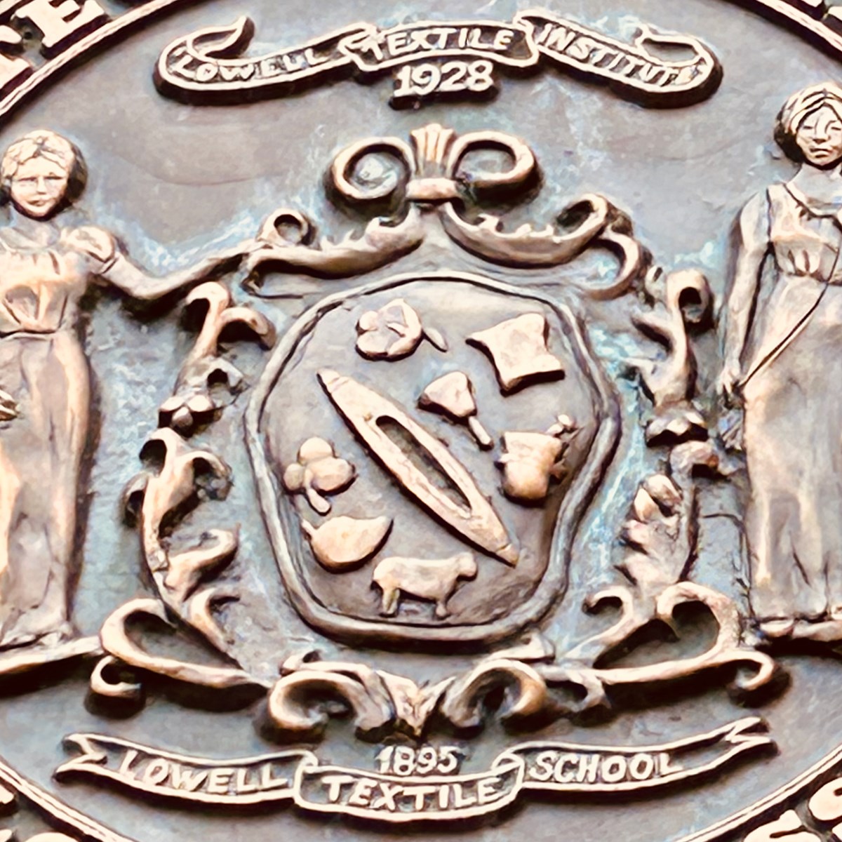 Zoomed in photo of Lowell Textile School shield