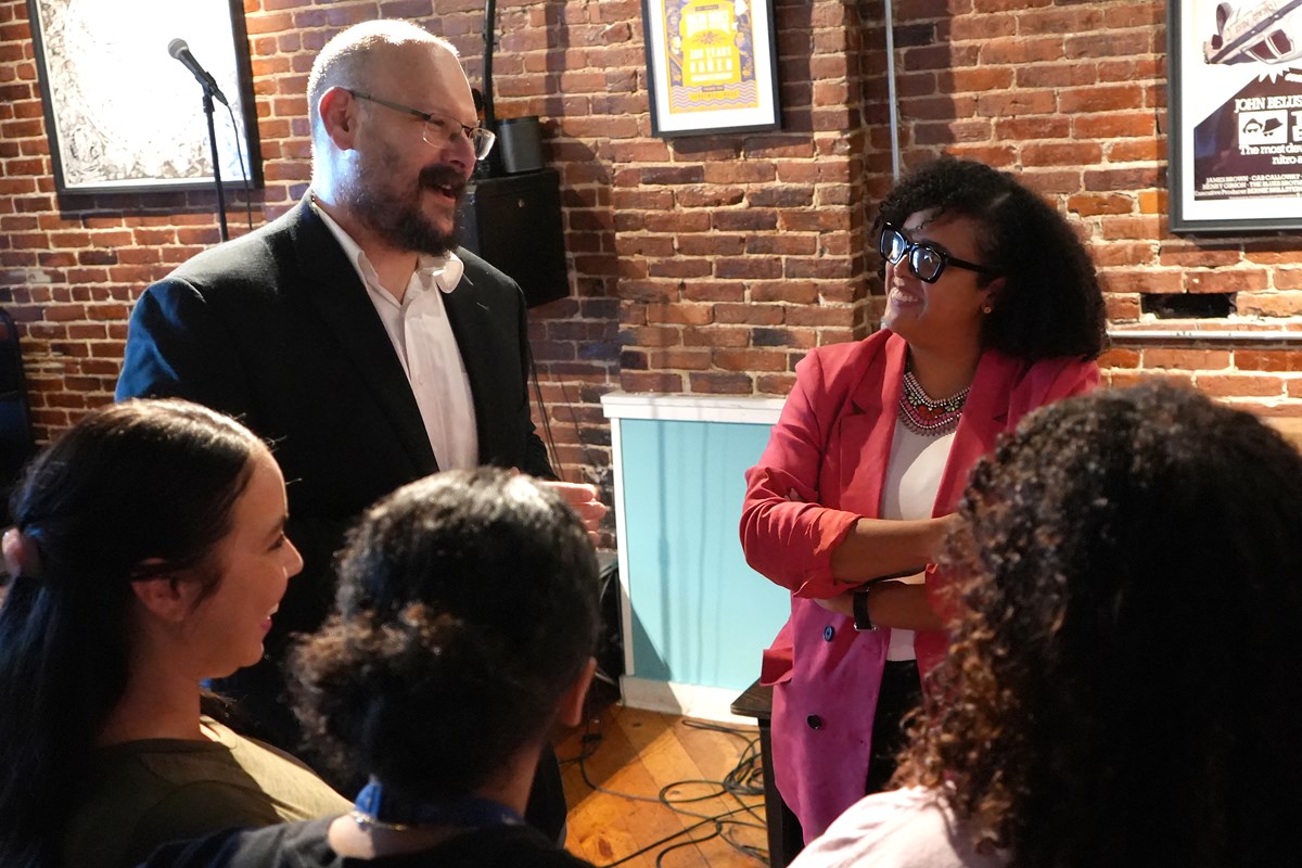 Aaron Smith-Walter and Marianela De La Cruz talk at the educator launch party.