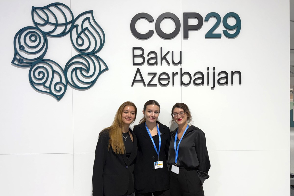 Three students at COP29 in Baku, Azerbaijan.