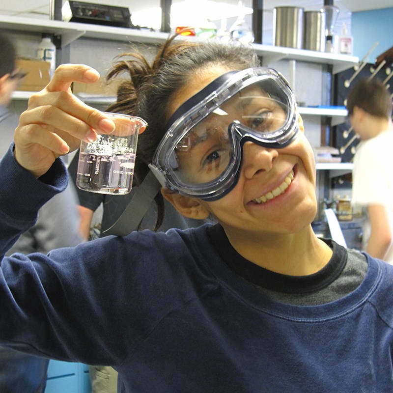 Girl in environmental engineering lab with water sample