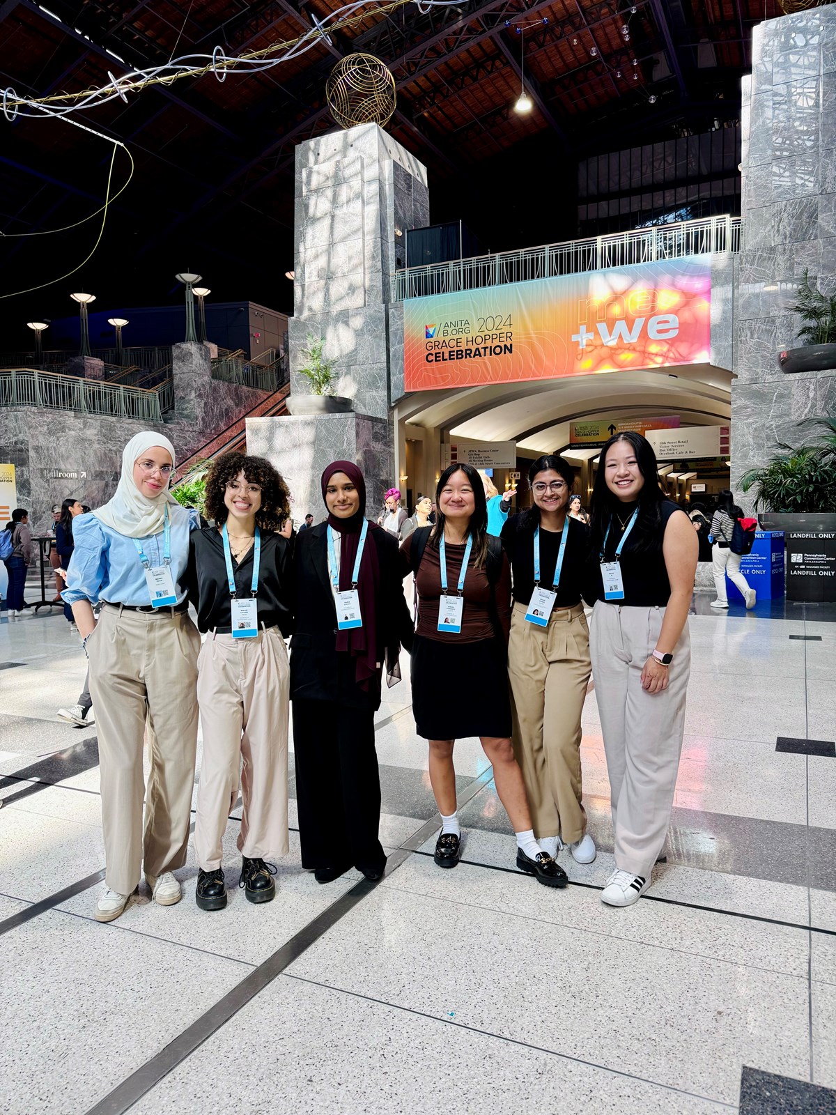 Six students stand at the AnitaB.org 2024 Grace Hopper Celebration.