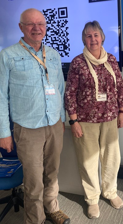 Two participants from age friendly event standing side by side.