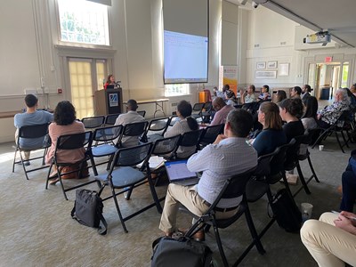 Group of UMass Lowell faculty listening to lecture by Vice Provost.