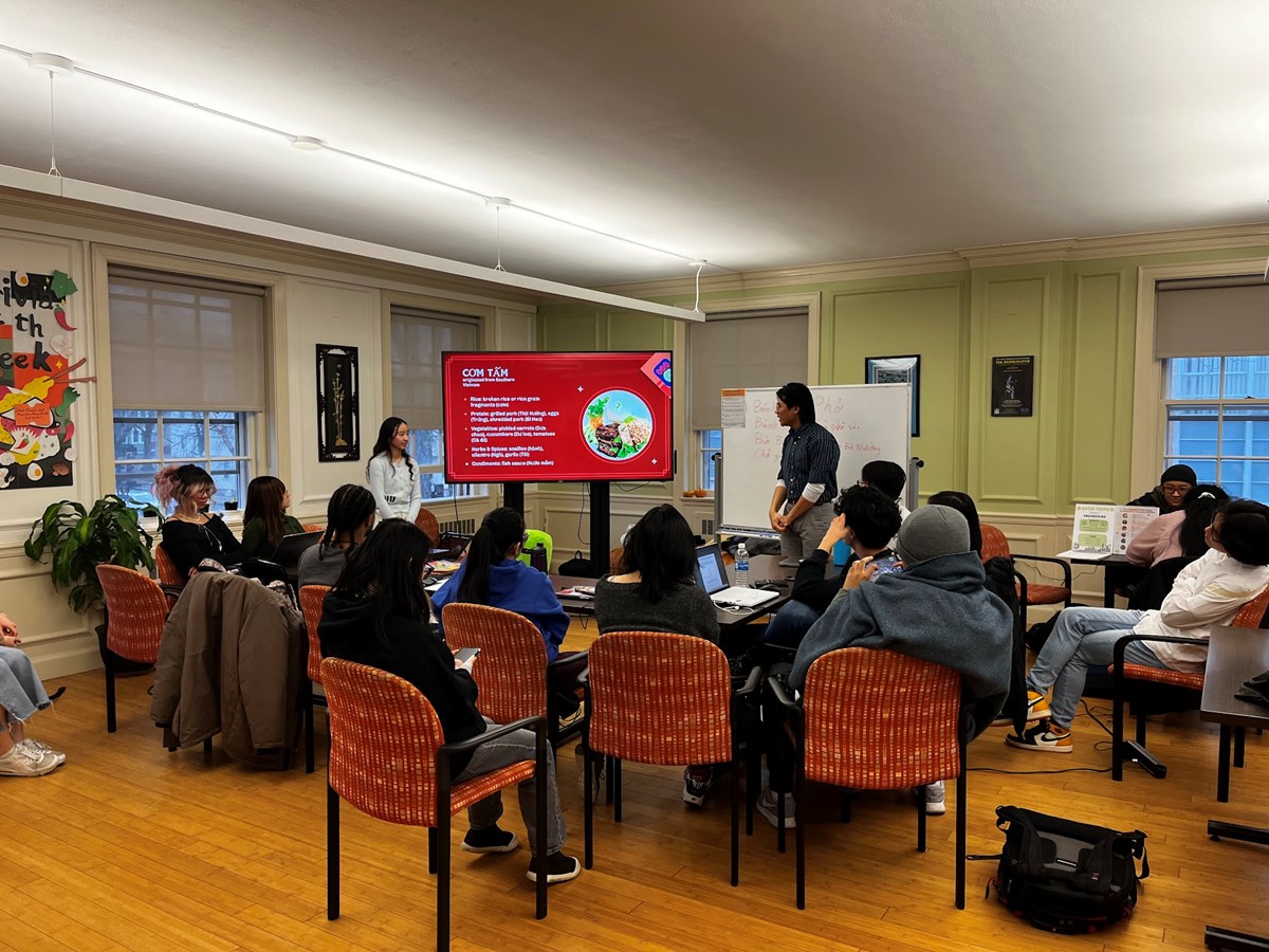 Students and a professor view a digital screen in a Vietnamese class at UMass Lowell.