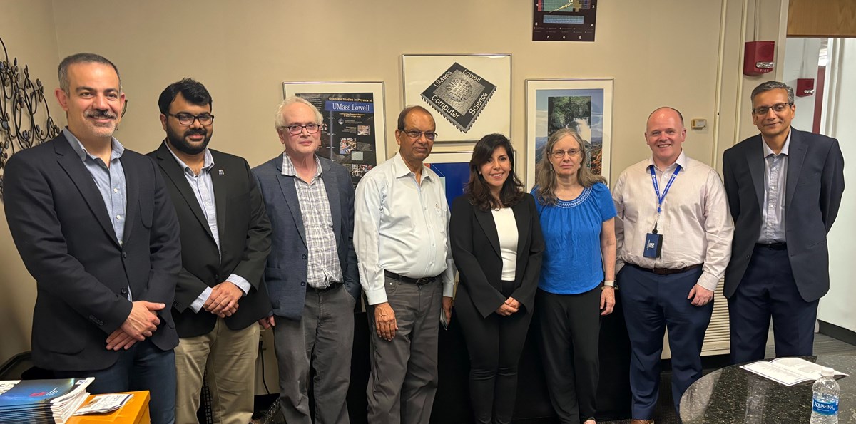 Members of the Selection Committee and recipients of the 2024 Graduate Fellowship award pose in a UMass Lowell office.