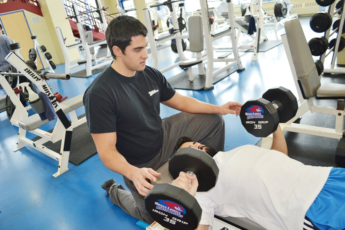 Student Spotting Weightlifter