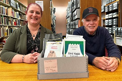 Image shows UMass Lowell graudate Jack Neary with Public Services and Special Collections Archivist for the Center for Lowell History Carisa Kolias. 