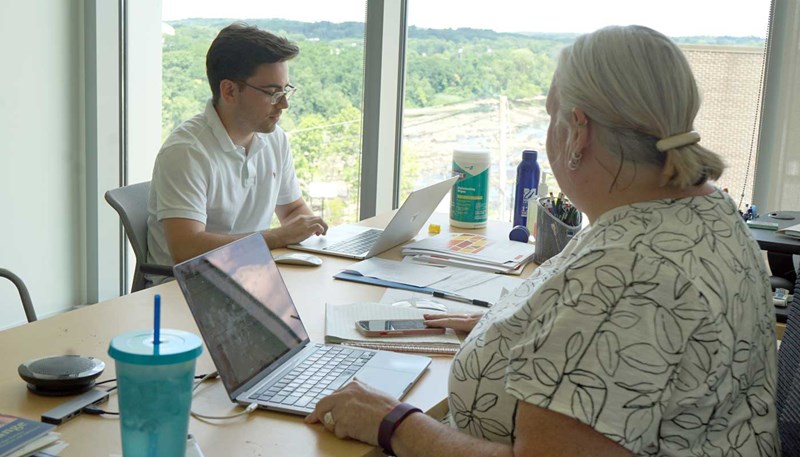 Jack Barron seated at a computer in an office