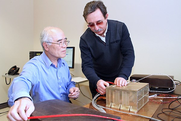 Paul Song and Ivan Galkin working in the lab