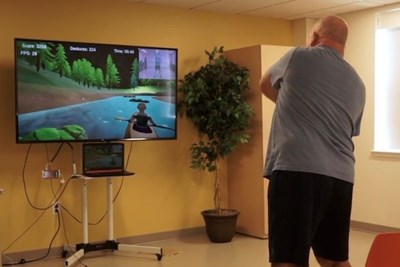 A man playing a rehabilitation video game 