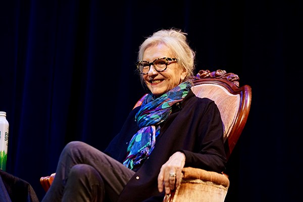 Author Elizabeth Strout sitting in an armchair and smiling