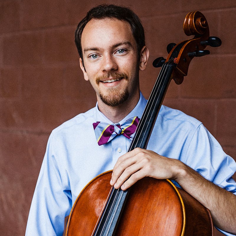 Benjamin Swartz holding his cello.