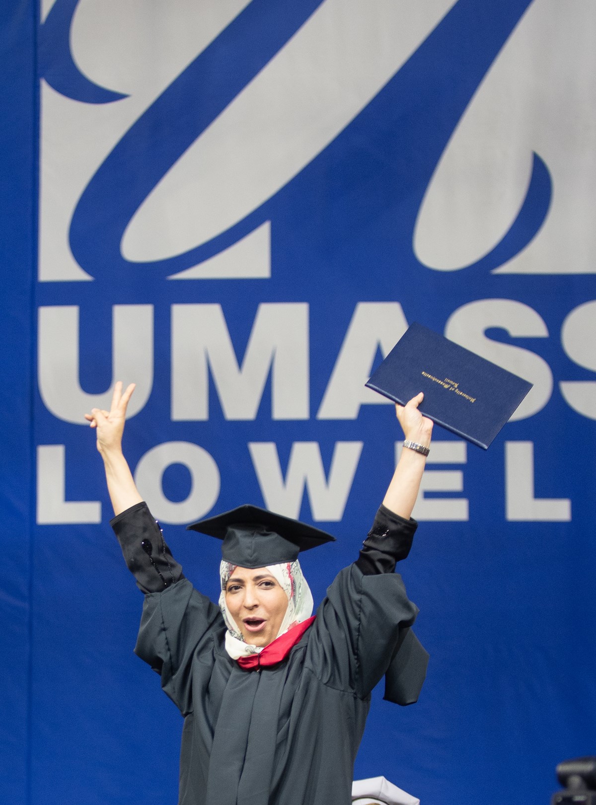 Tawakkol Karman raises her diploma over her head