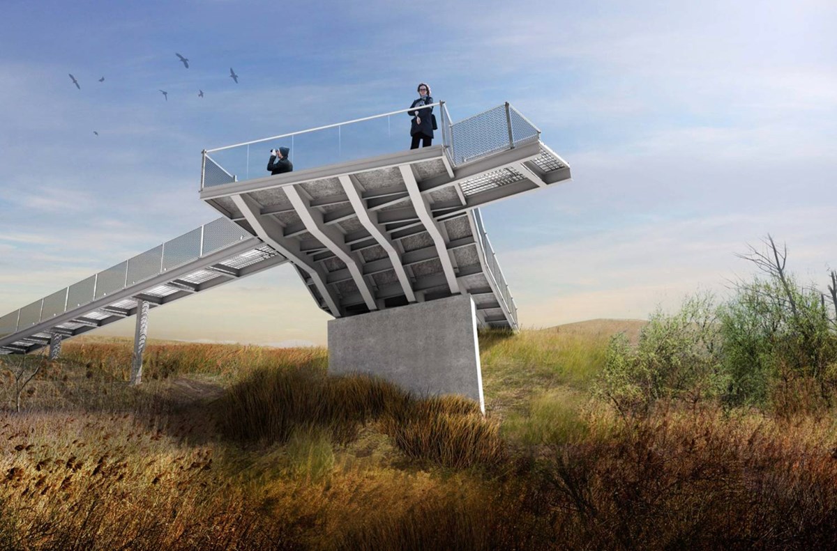 People standing on elevated metal ramp structure in field