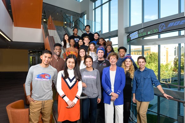 Chancellor Jacquie Moloney visits with students in the lobby of the Pulichino Tong Business Center